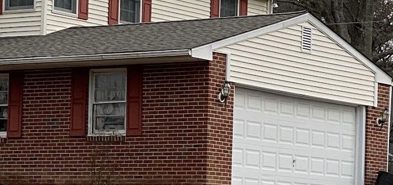 Roofline with gutters on a brick home