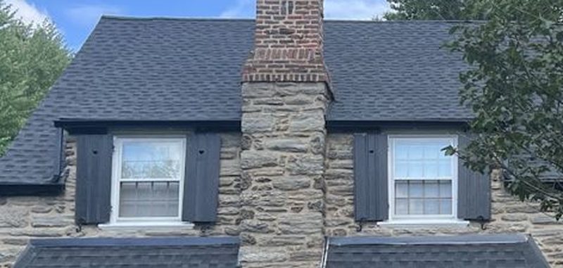 Dark architectural shingle roof with dormers