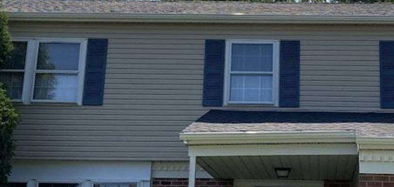 Vinyl siding with shutters on a two-story home