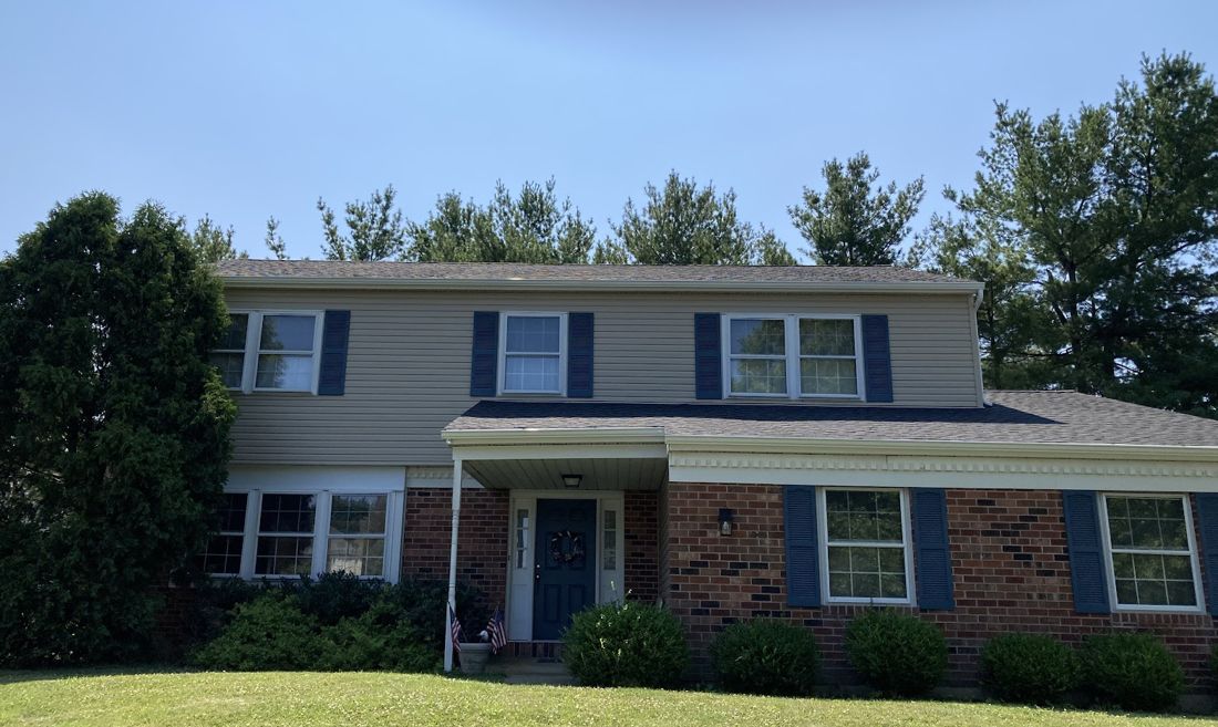 Two-story home with new roof, vinyl siding and gutters